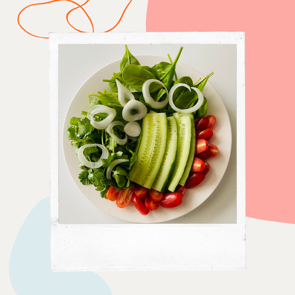 Plate of cucumber, avocado, and tomato slices
