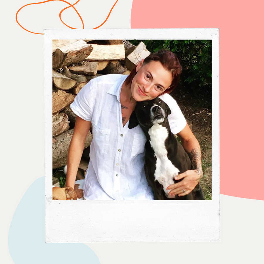 Dr. Sarah Dodd with a black-and-white dog
