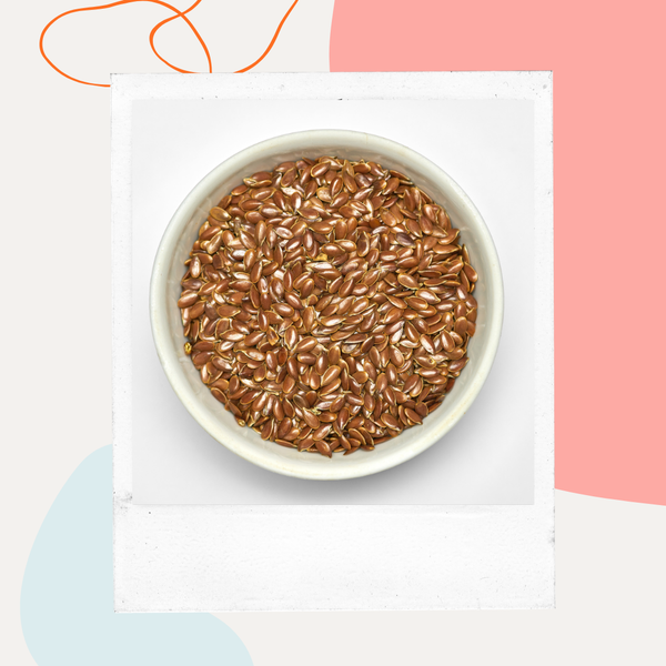 A white bowl filled with flaxseeds