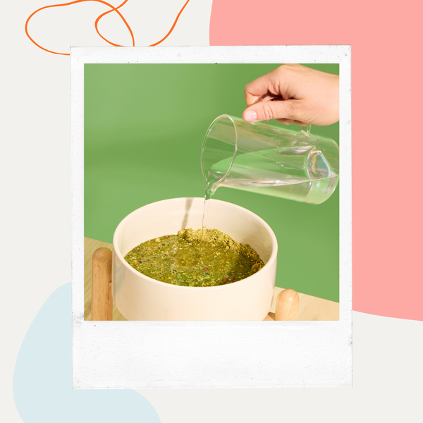 Water being poured into a bowl of Petaluma Whole Food Mixer