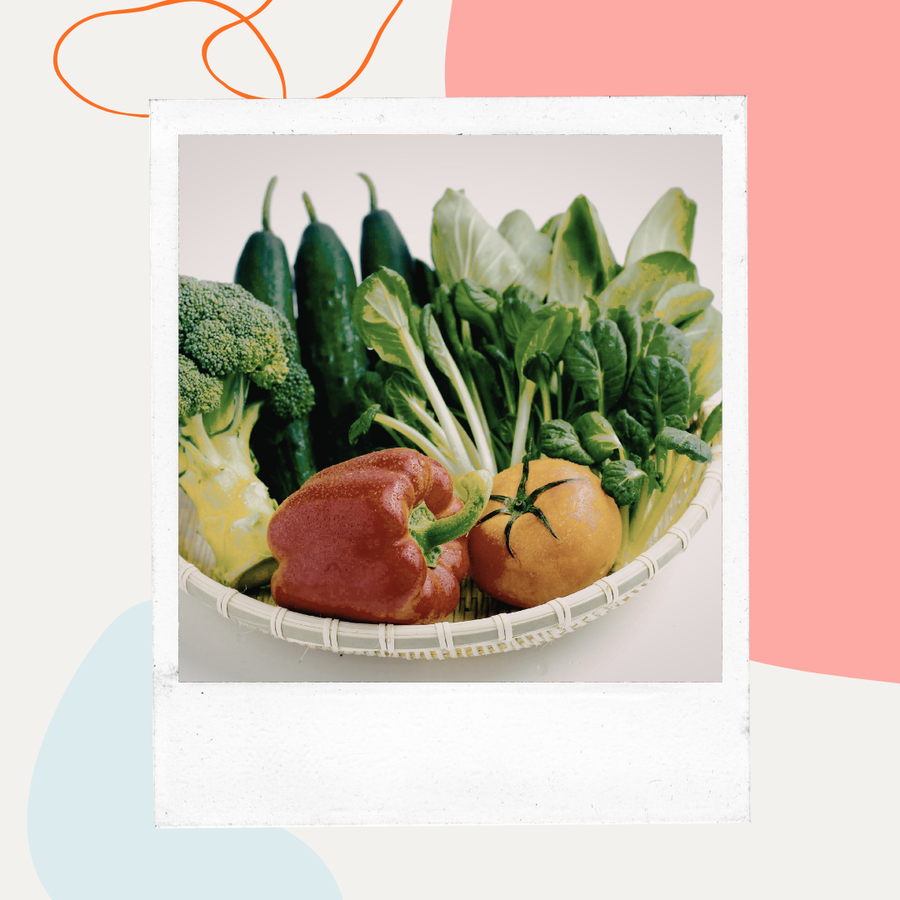 Basket of fresh vegetables and leafy greens