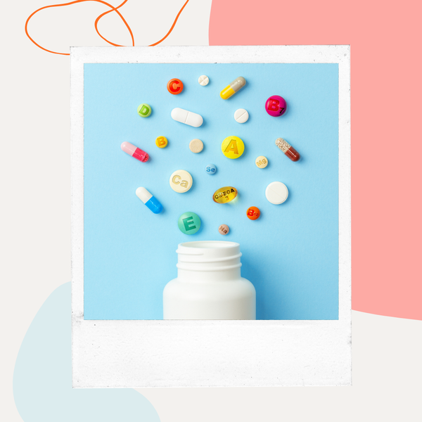 Colorful vitamin pills spilling from a bottle