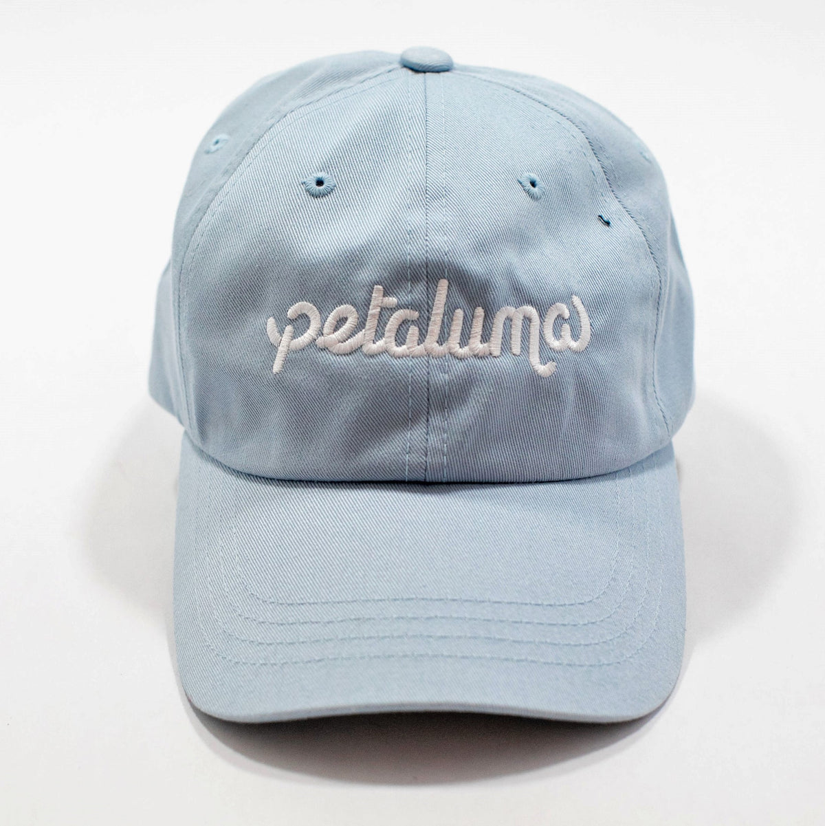 Light blue Petaluma dog-walking hat with embroidered logo, front view